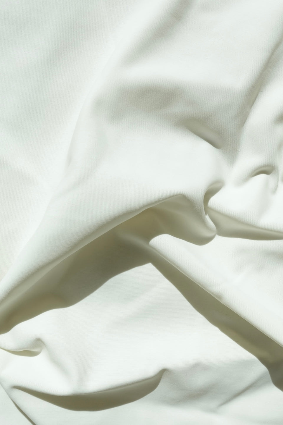 Close-up of white fabric with folds
